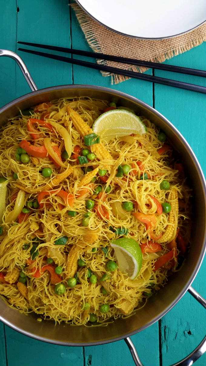 Vegetable Singapore noodles are a great 15-minute weeknight dinner. Stir-fried mixed veggies served with curry flavoured rice vermicelli noodles and a squeeze of lime. A great vegetarian or vegan main dish.
