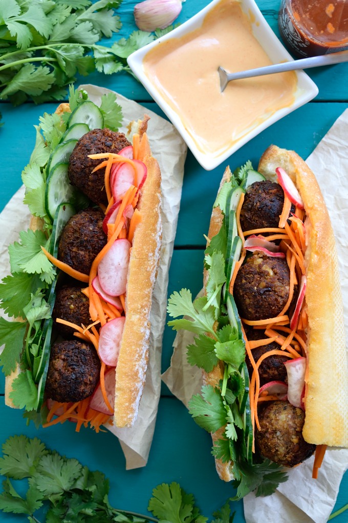 These vegan meatball banh mi are so tasty you'd never guess that they were totally plant-based. Stuffed with fresh herbs, a quick carrot-radish pickle and slathered with spicy vegan sriracha mayonnaise, one of these babies will satisfy every craving!